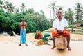 Weligama, Sri Lanka Ã¢â¬â December 21, 2017: Two Fishermen standing on the beach after the fishing in the morning time in Weligama,